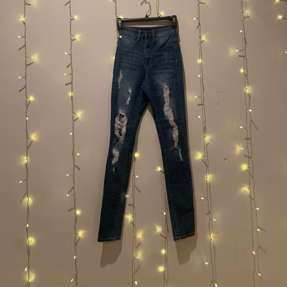 Ripped High waist skinny jeans . Size 3. NWOT.